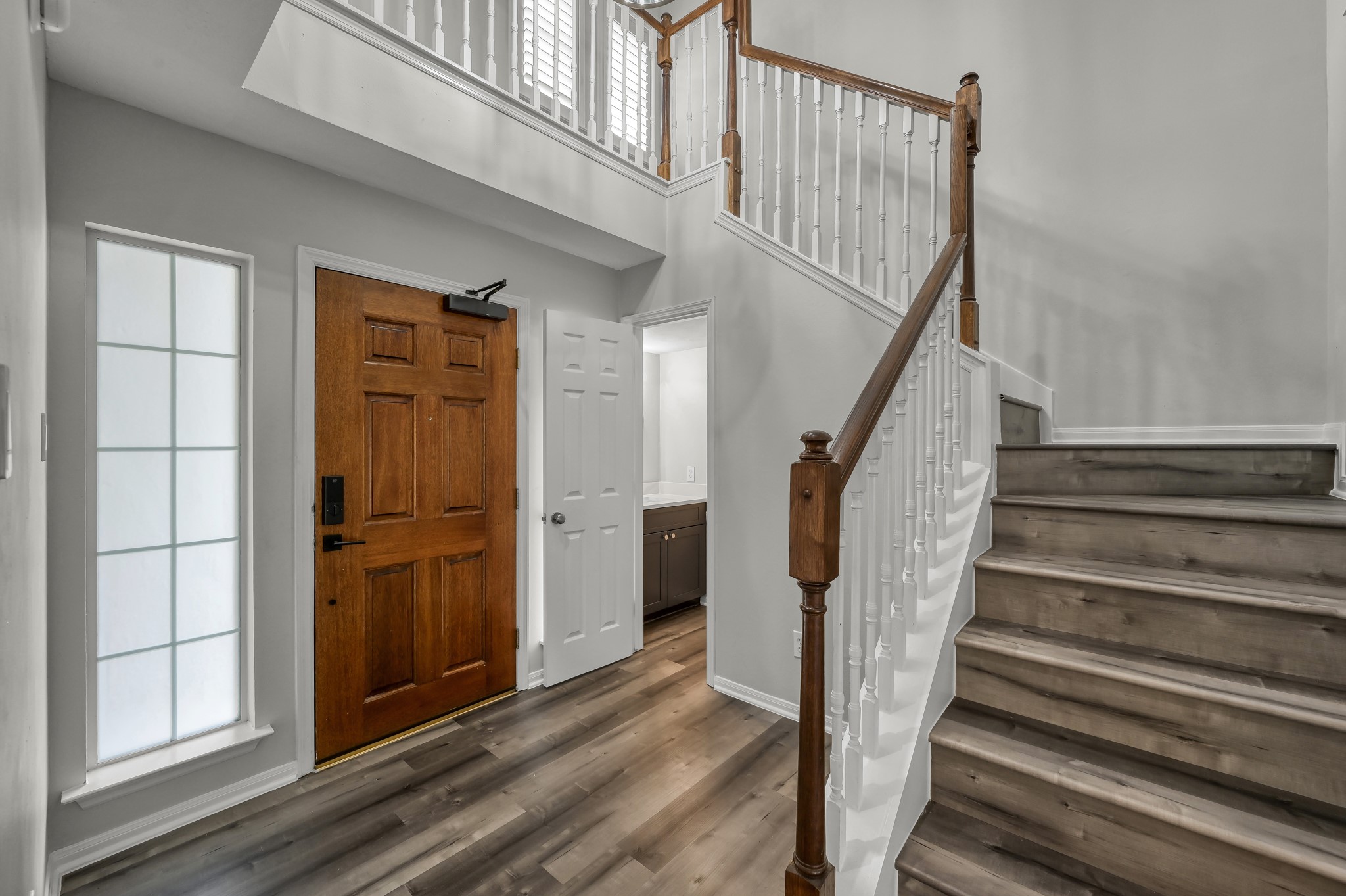 23 Alderon Woods Place Spring, TX 77382 - Photo 8 of 25 a view of entryway with wooden floor and stairs