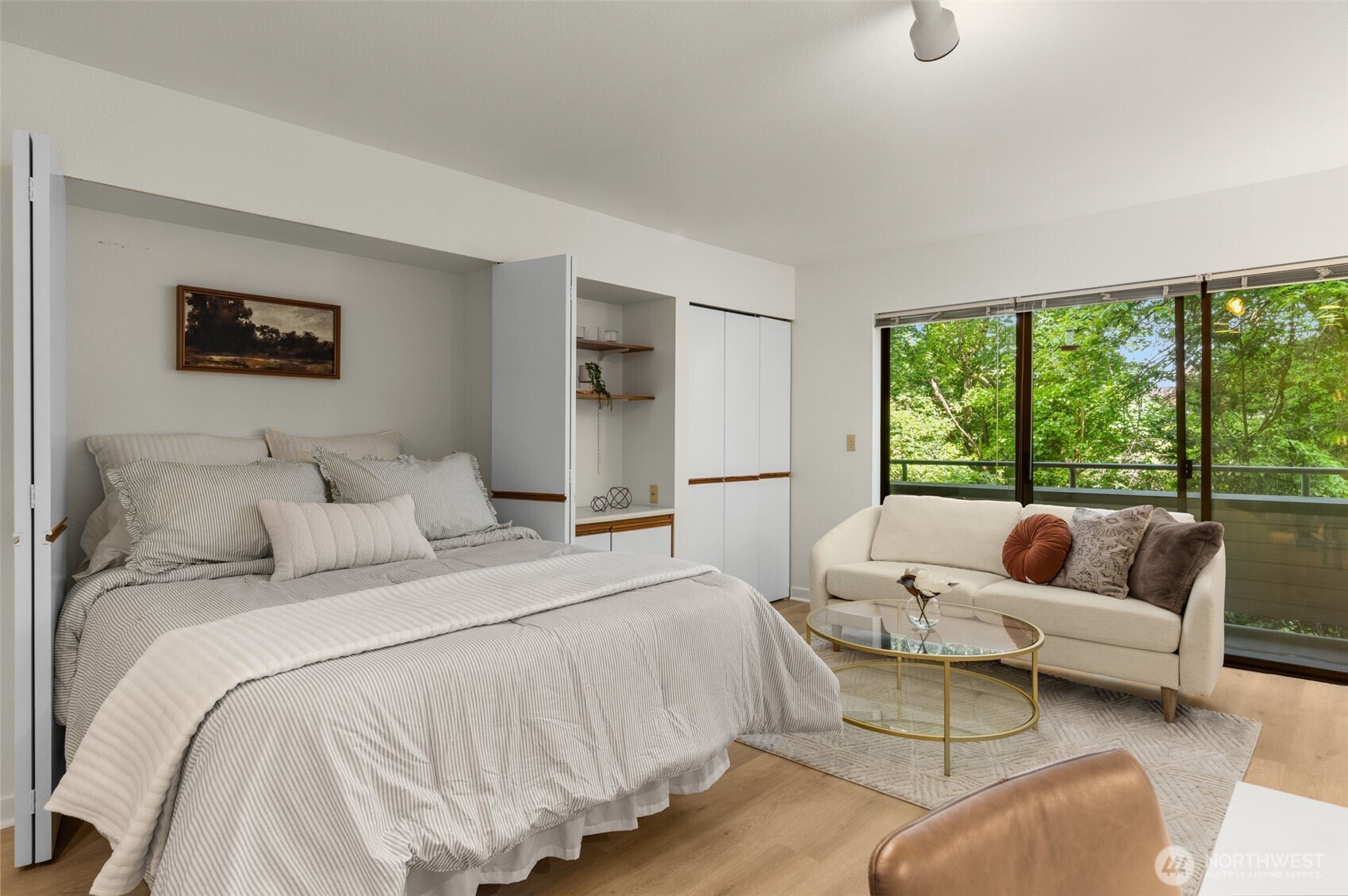 211 Summit Avenue East, Unit S218 Seattle, WA 98102 - Photo 2 of 19 a bedroom with bed and a large window