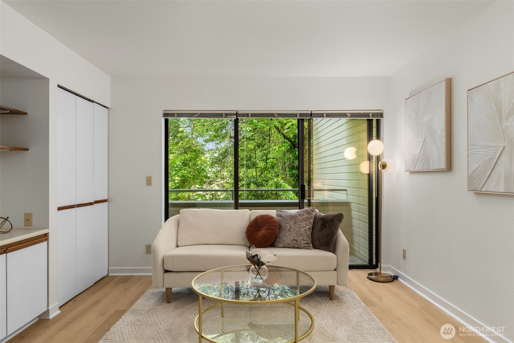 211 Summit Avenue East, Unit S218 Seattle, WA 98102 - Photo 7 of 19 a living room with furniture and a large window