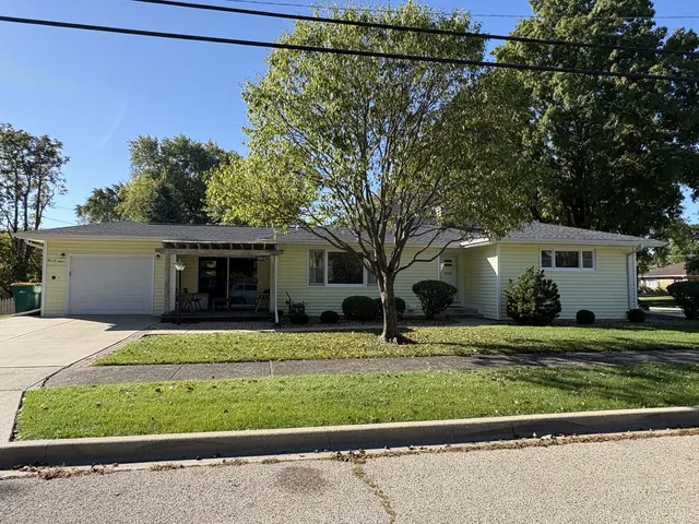a house that has a tree in front of it