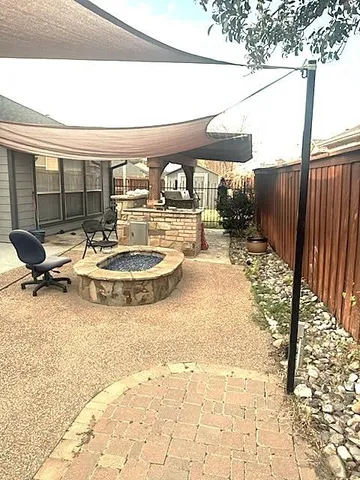 a view of a swimming pool with a patio