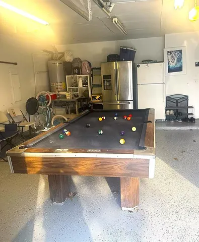 a view of a balcony with wooden floor and iron fence