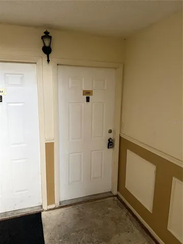 an empty room with a mirror