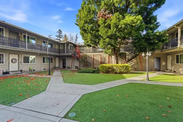 a view of a house with a yard