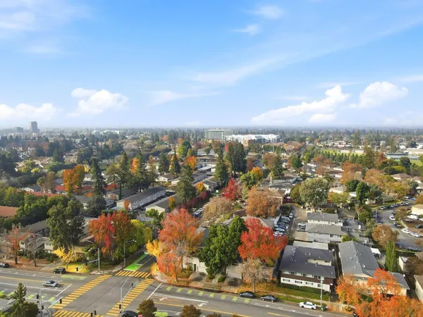 an aerial view of residential houses with outdoor space