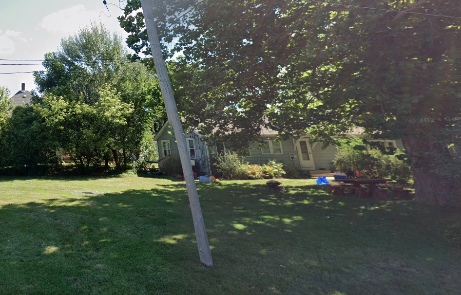 6020 Hickory Street Harvard, IL 60033 - Photo 2 of 17 a backyard of a house with table and chairs