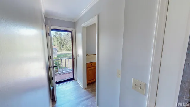 a view of an front door and a room