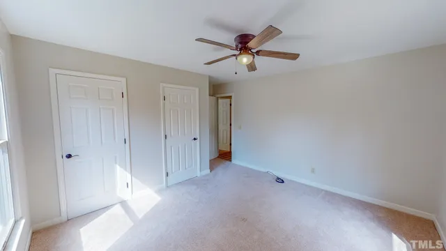 a view of a livingroom with a ceiling fan