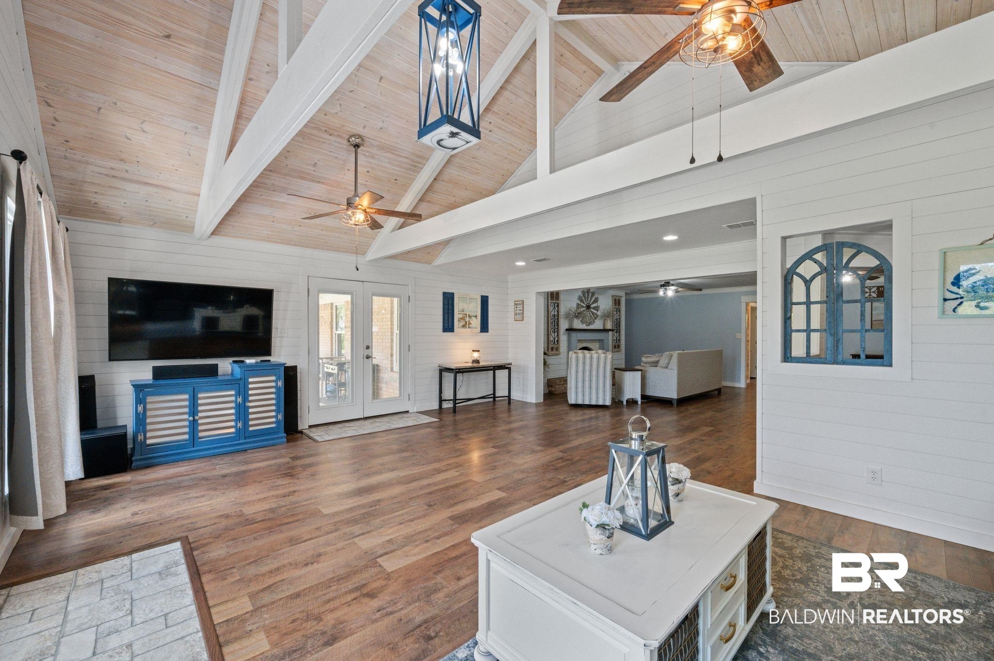 20037 County Road 33 Fairhope, AL 36532 - Photo 11 of 79 Living room with beamed ceiling, french doors, dark wood-type flooring, and wooden ceiling