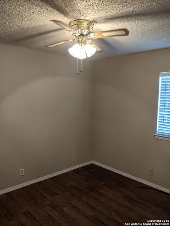 a view of a chandelier fan in a room