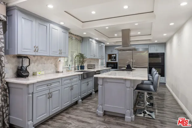 a bathroom with a granite countertop sink mirror and toilet