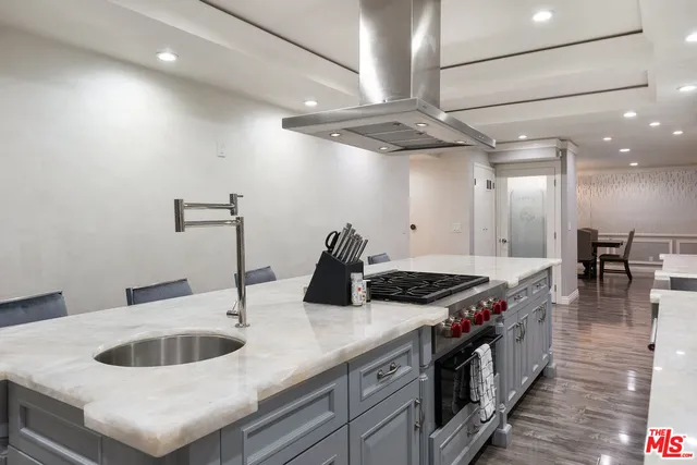 a large bed sitting in a bedroom next to a window