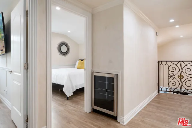 a bedroom with a bed and a walk in closet