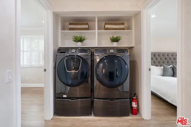 a spacious bathroom with a granite countertop sink and a mirror