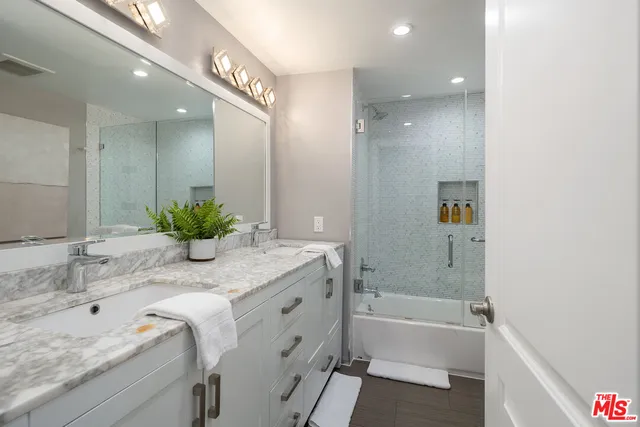 a bedroom with a bed and a walk in closet