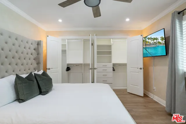 a view of a patio with a dining table and chairs with wooden floor