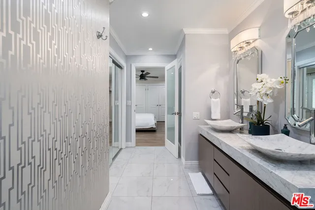 a view of a backyard with a tub and chairs under an umbrella