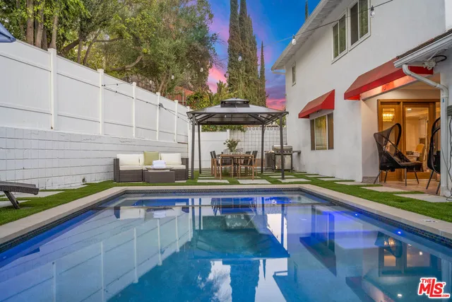 a living room with furniture or couch and a wooden floor