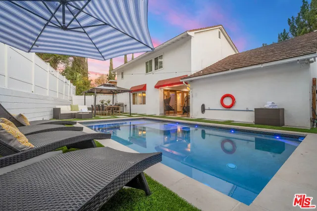 a view of a a dining room with furniture window and wooden floor