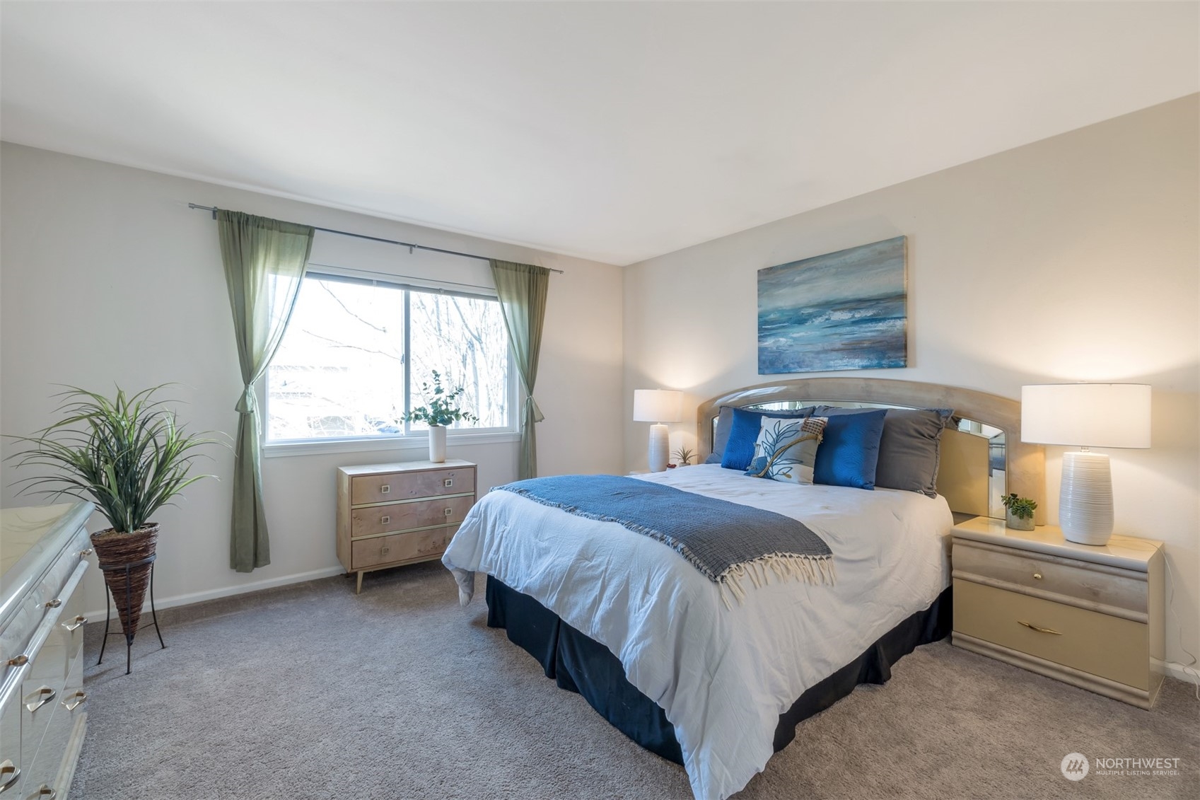 108 South 49th Street, Unit B Renton, WA 98055 - Photo 13 of 24 a bedroom with a large bed and a window