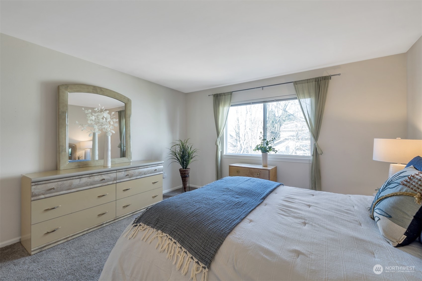 108 South 49th Street, Unit B Renton, WA 98055 - Photo 14 of 24 a bedroom with a large bed and a window