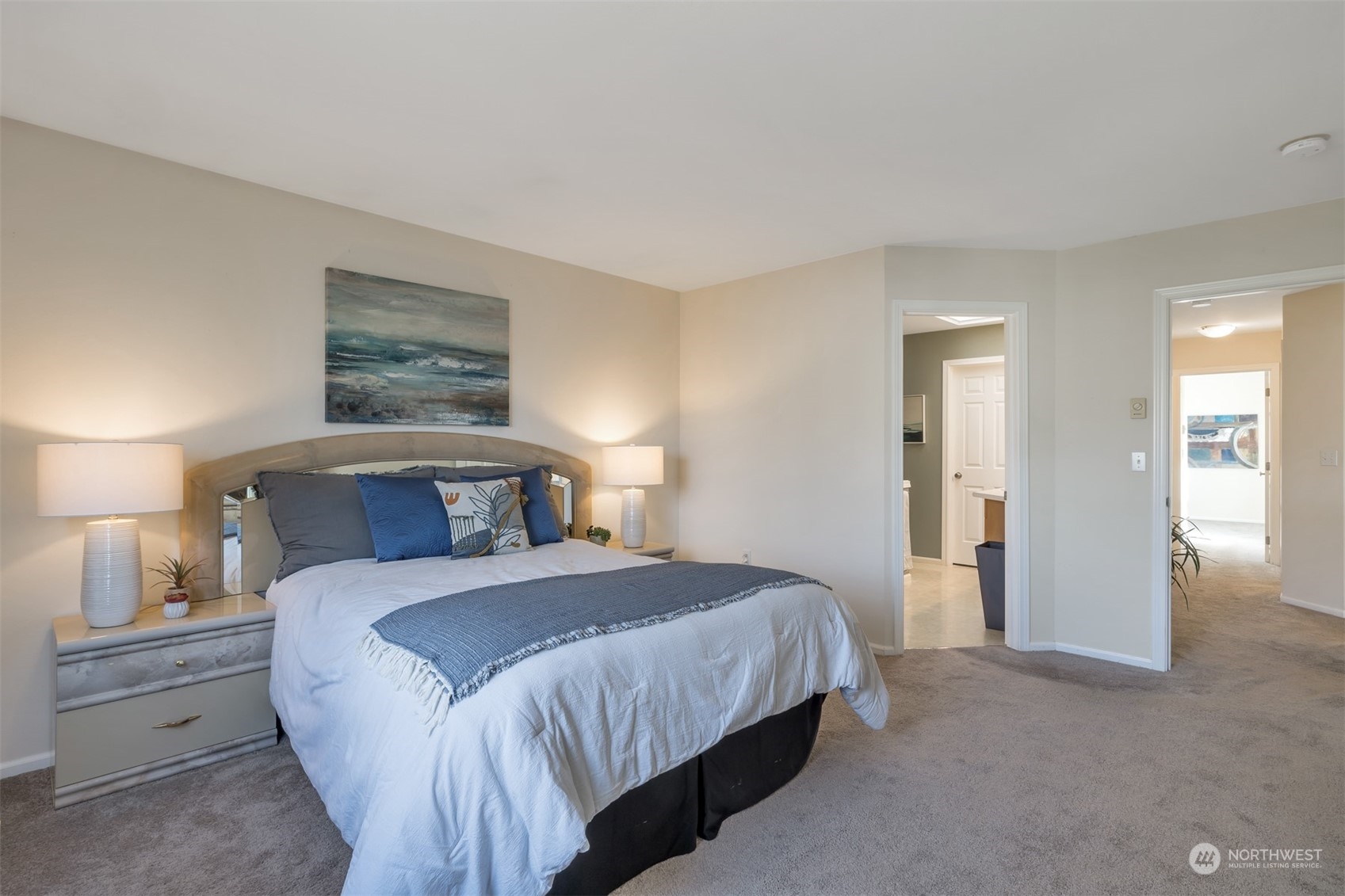 108 South 49th Street, Unit B Renton, WA 98055 - Photo 15 of 24 a bedroom with a bed and a painting on the wall