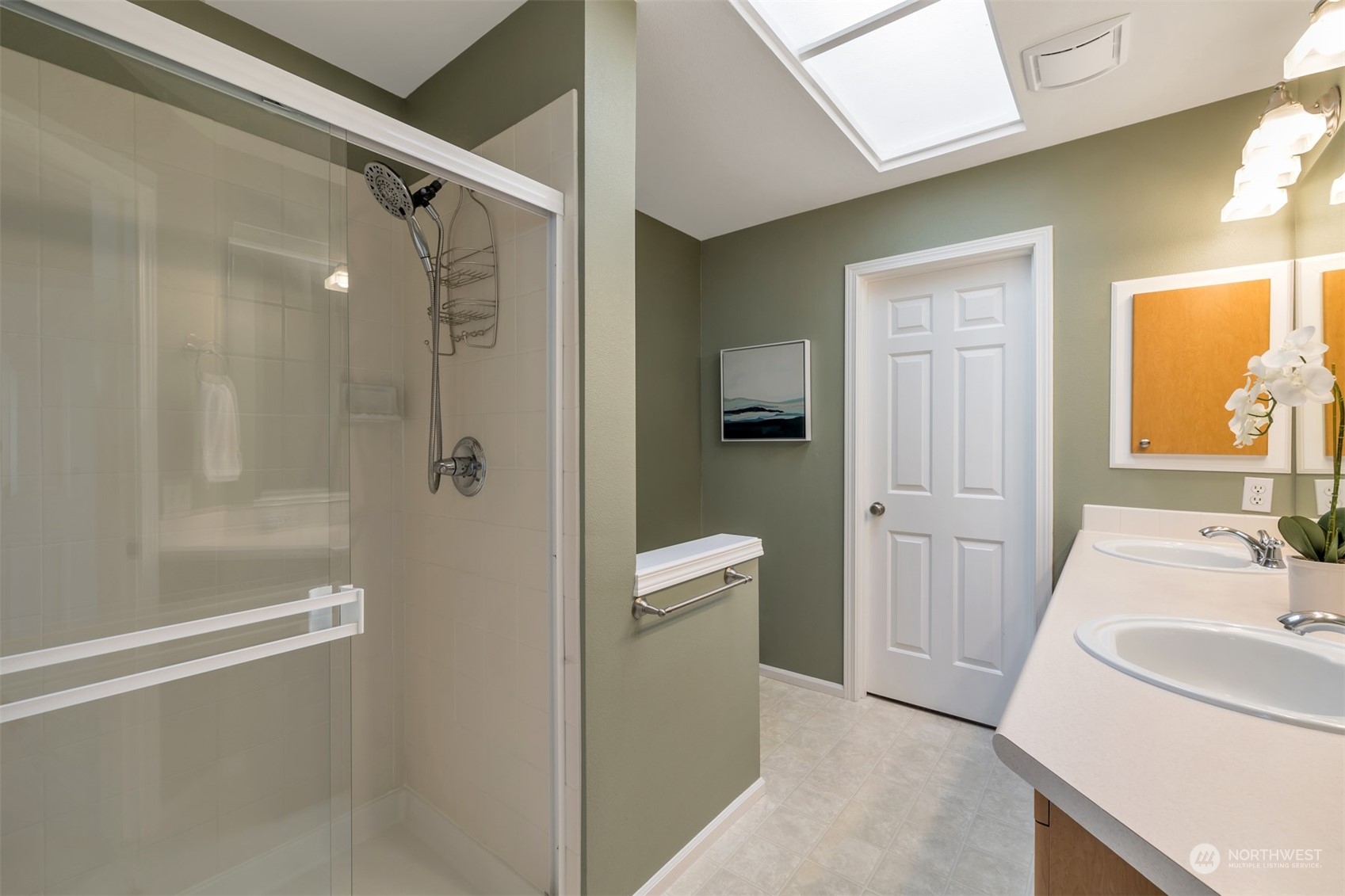 108 South 49th Street, Unit B Renton, WA 98055 - Photo 16 of 24 a bathroom with a sink a toilet and shower