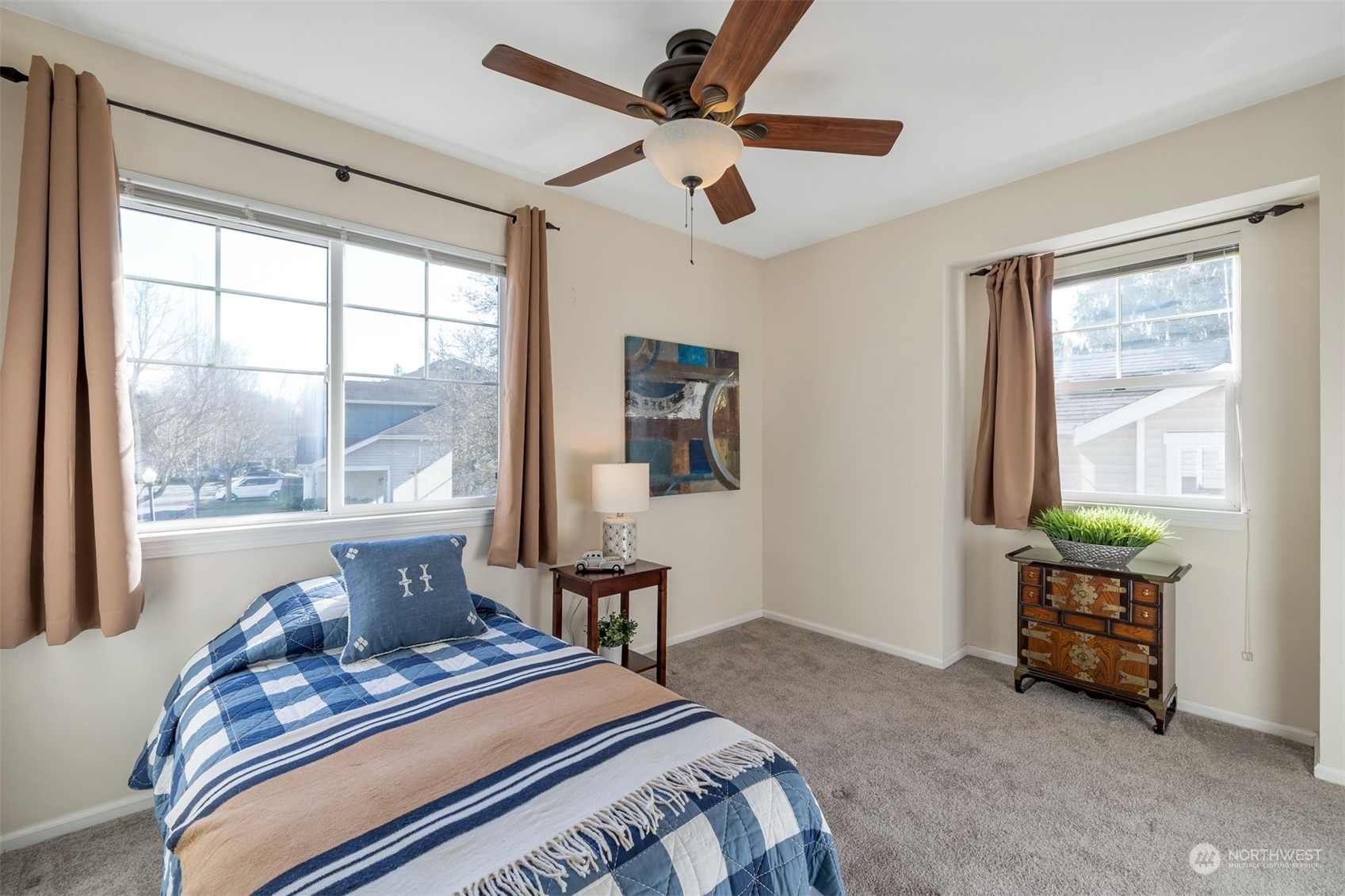 108 South 49th Street, Unit B Renton, WA 98055 - Photo 17 of 24 a bedroom with a bed and a window