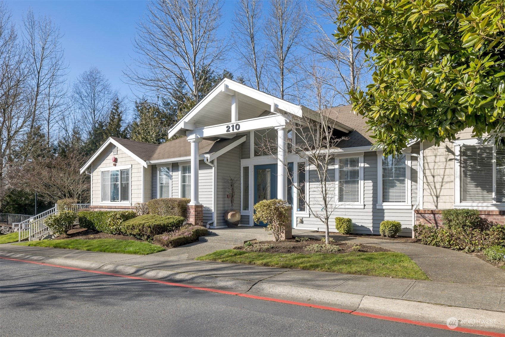 108 South 49th Street, Unit B Renton, WA 98055 - Photo 21 of 24 a front view of a house with garden