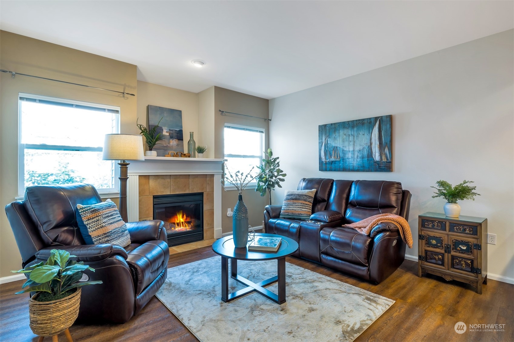 108 South 49th Street, Unit B Renton, WA 98055 - Photo 4 of 24 a living room with furniture and a fireplace