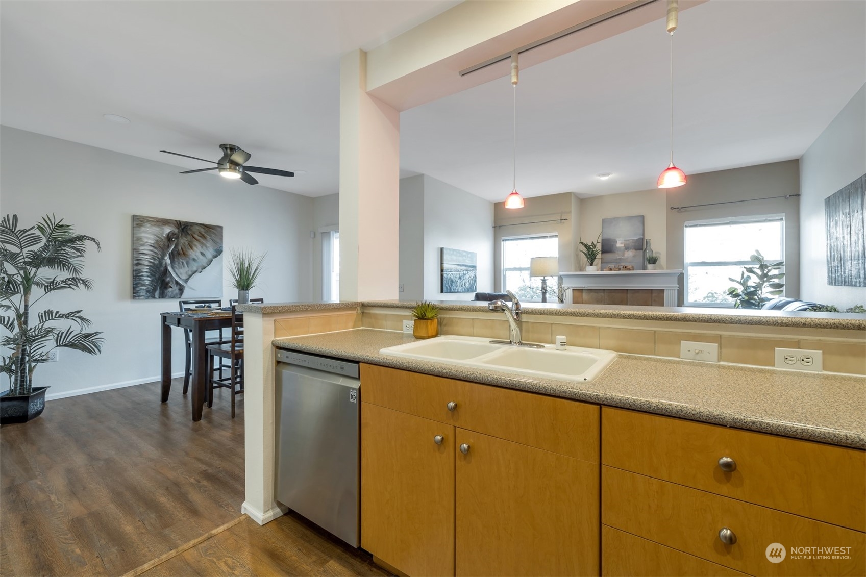 108 South 49th Street, Unit B Renton, WA 98055 - Photo 9 of 24 a kitchen with stainless steel appliances granite countertop a sink and cabinets
