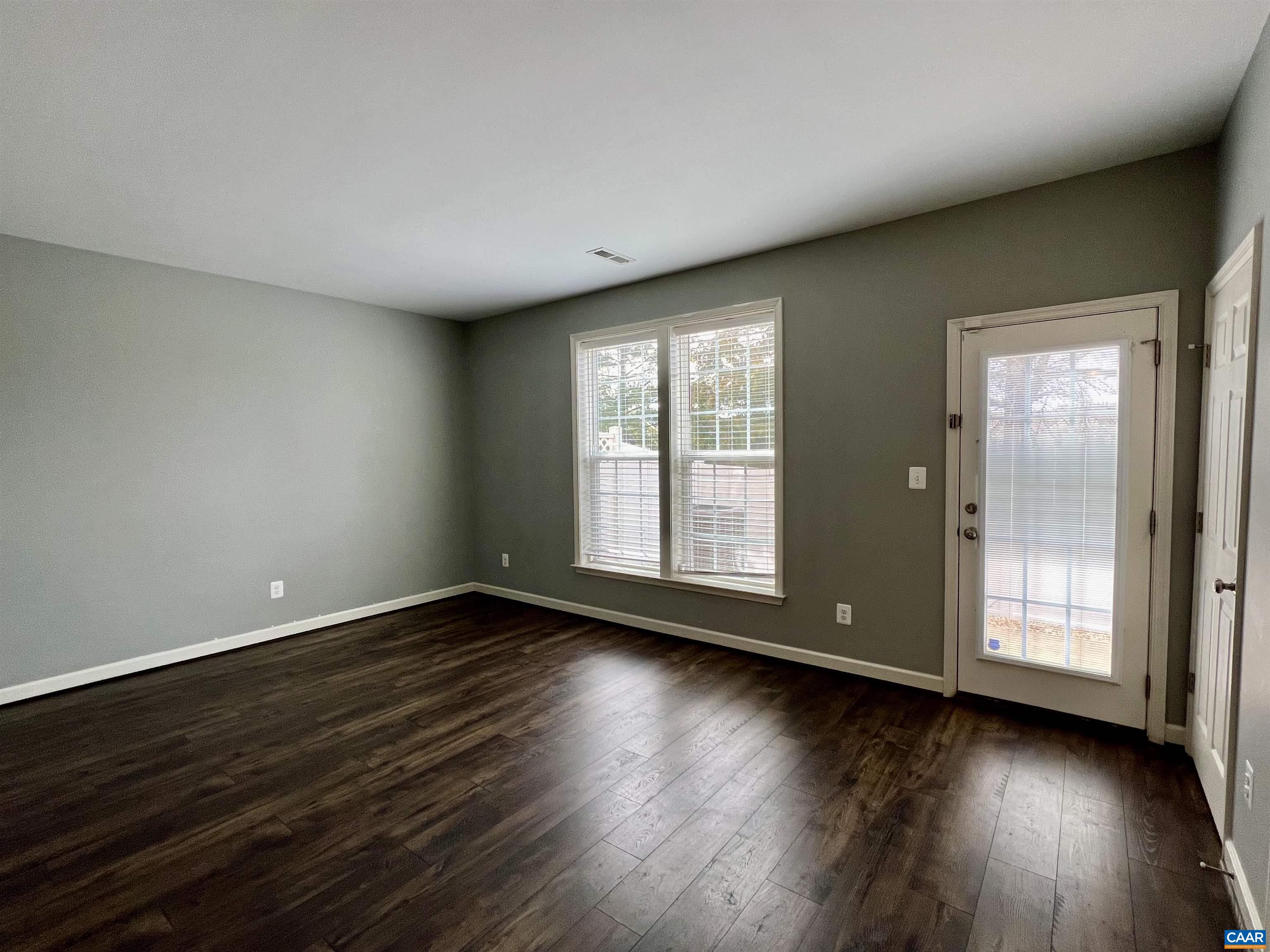 2545 Avemore Pond Road Charlottesville, VA 22911 - Photo 13 of 17 an empty room with wooden floor and windows