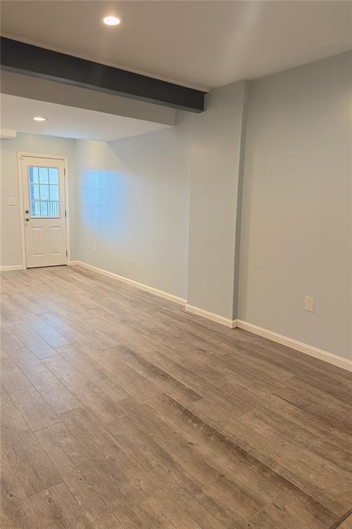 305 Garden Court Gibsonia, PA 15044 - Photo 27 of 28 a view of an empty room with wooden floor and entryway