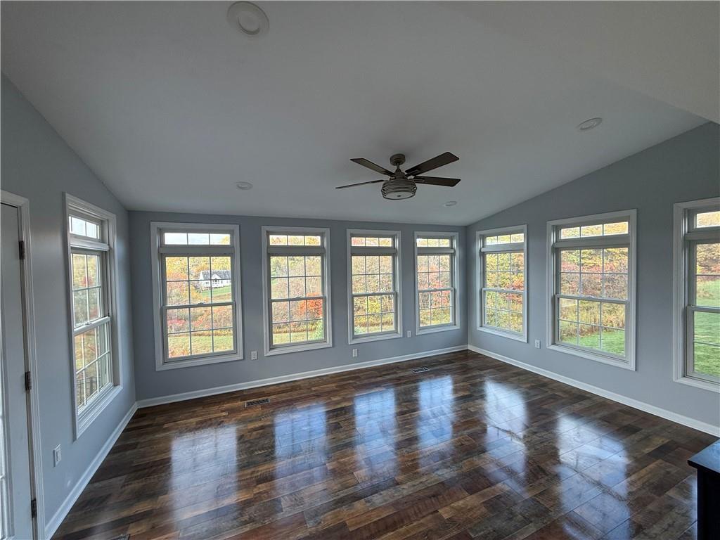 305 Garden Court Gibsonia, PA 15044 - Photo 9 of 28 a view of an empty room with wooden floor and a window