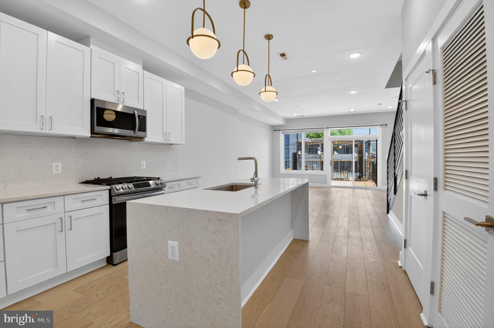 217 20th Street Northeast, Unit 2 Washington, DC 20002 - Photo 4 of 17 Modern kitchen with natural light.