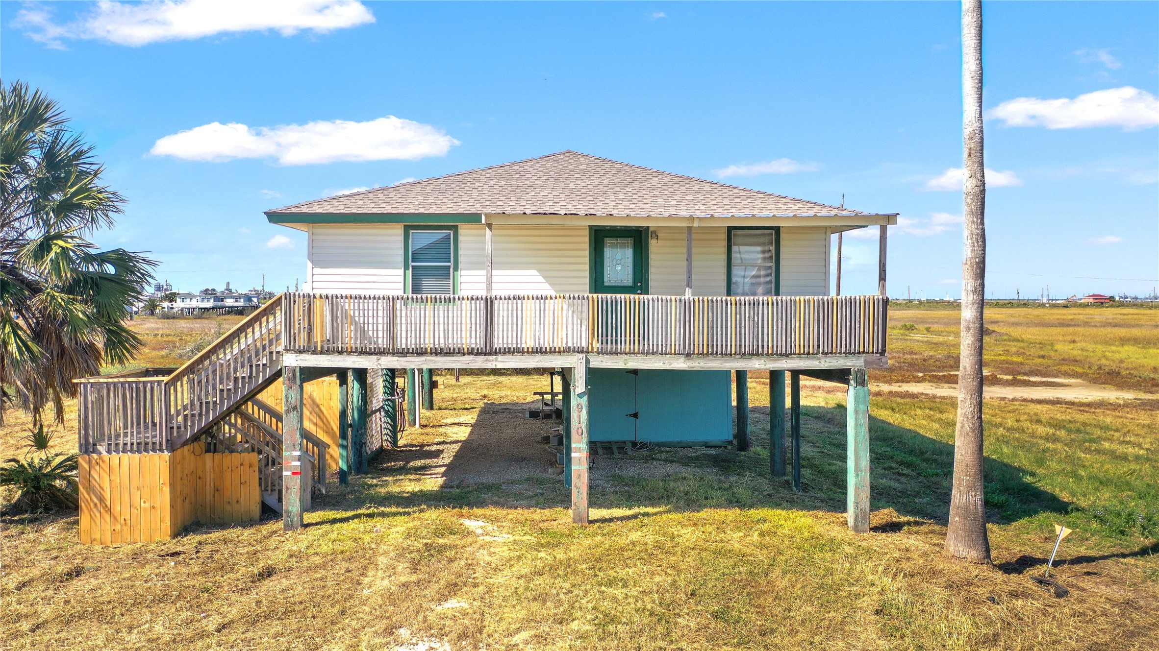 910 Monument Drive Surfside Beach, TX 77541 - Photo 28 of 29 a view of a house with a swimming pool