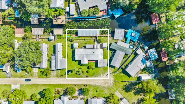 a view of a house with garden and yard