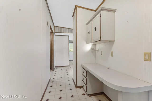 a view of a hallway to a bedroom