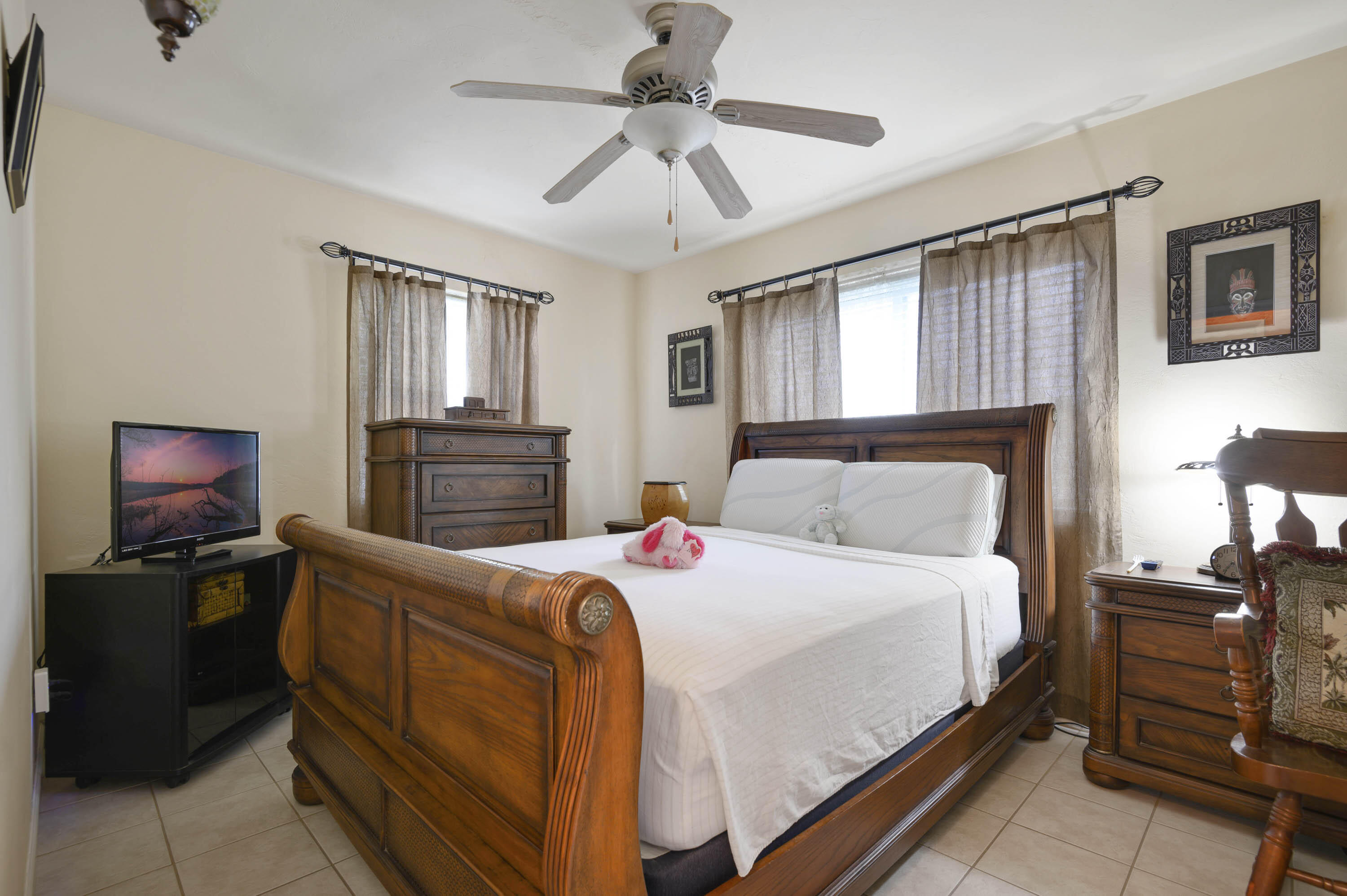 939 Bianca Drive Northeast Palm Bay, FL 32905 - Photo 13 of 26 a bedroom with a bed and furniture