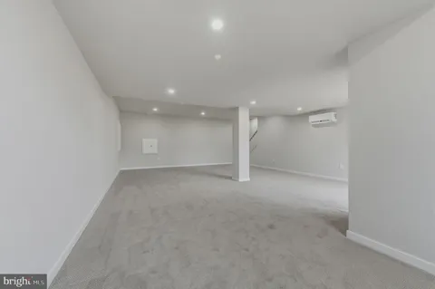 a view of a big room with a ceiling fan