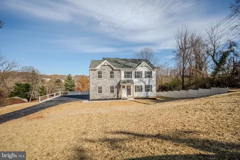 a view of a building with a yard