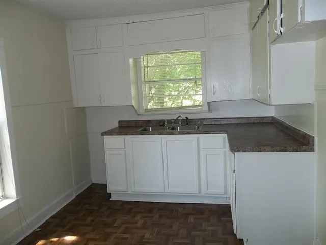 a view of cabinets and window