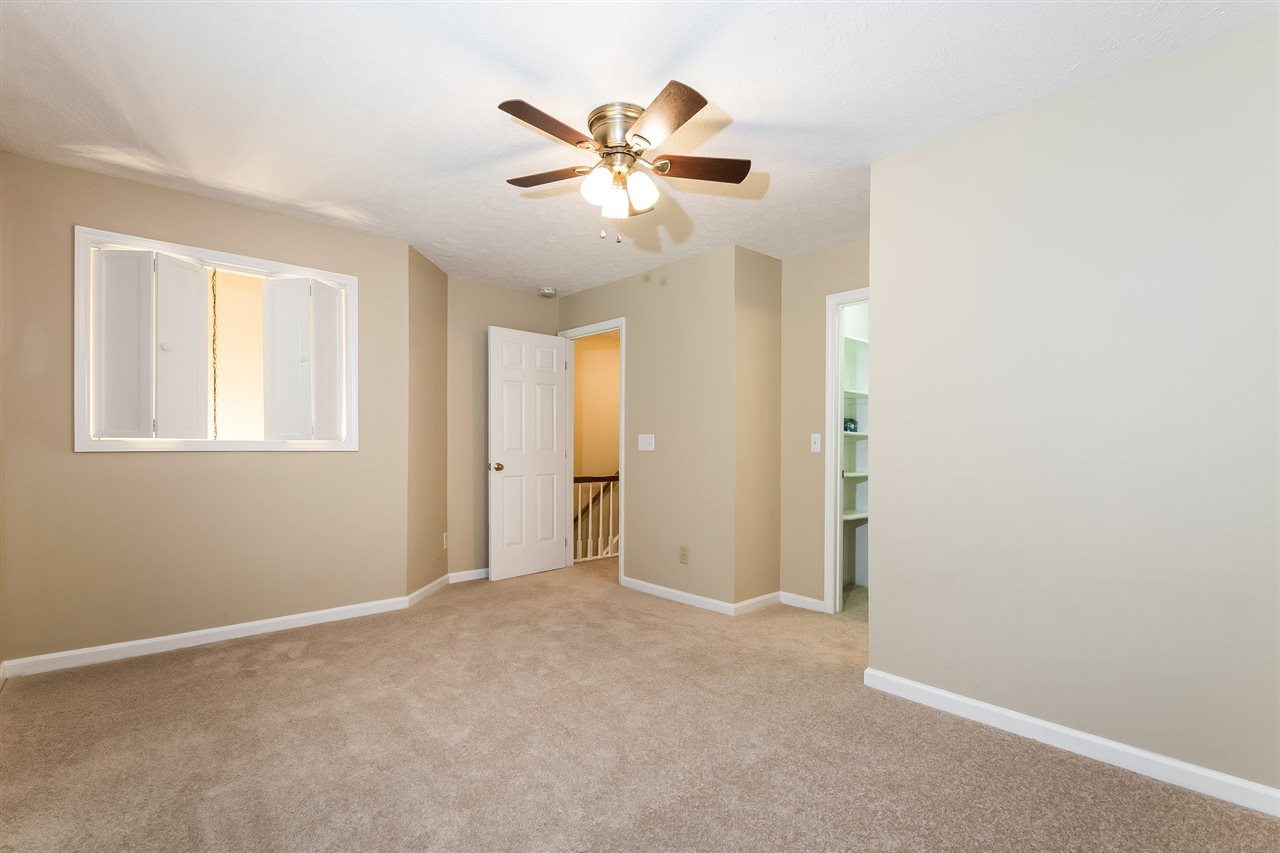 402 Broad Leaf Circle Raleigh, NC 27613 - Photo 8 of 17 a view of an empty room with a window