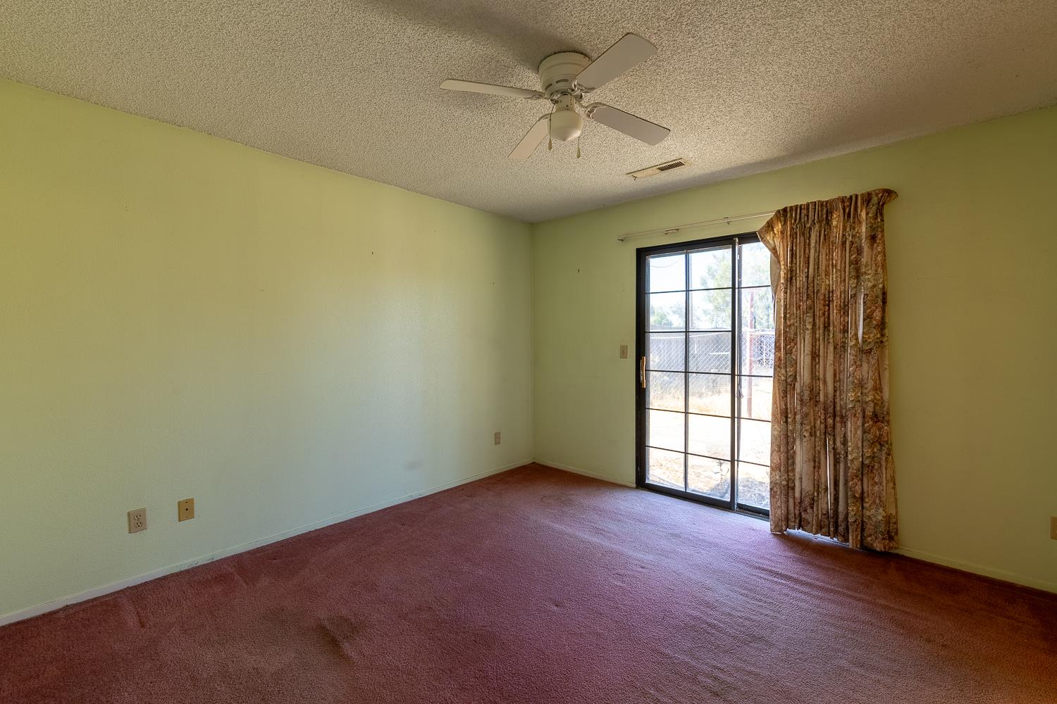25199 Ave 18 Madera, CA 93638 - Photo 14 of 20 an empty room with a empty space and windows