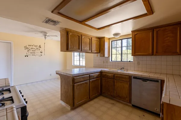 a kitchen with a sink and cabinets