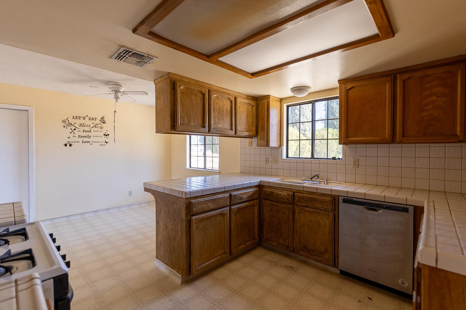 25199 Ave 18 Madera, CA 93638 - Photo 6 of 20 a kitchen with a sink and cabinets