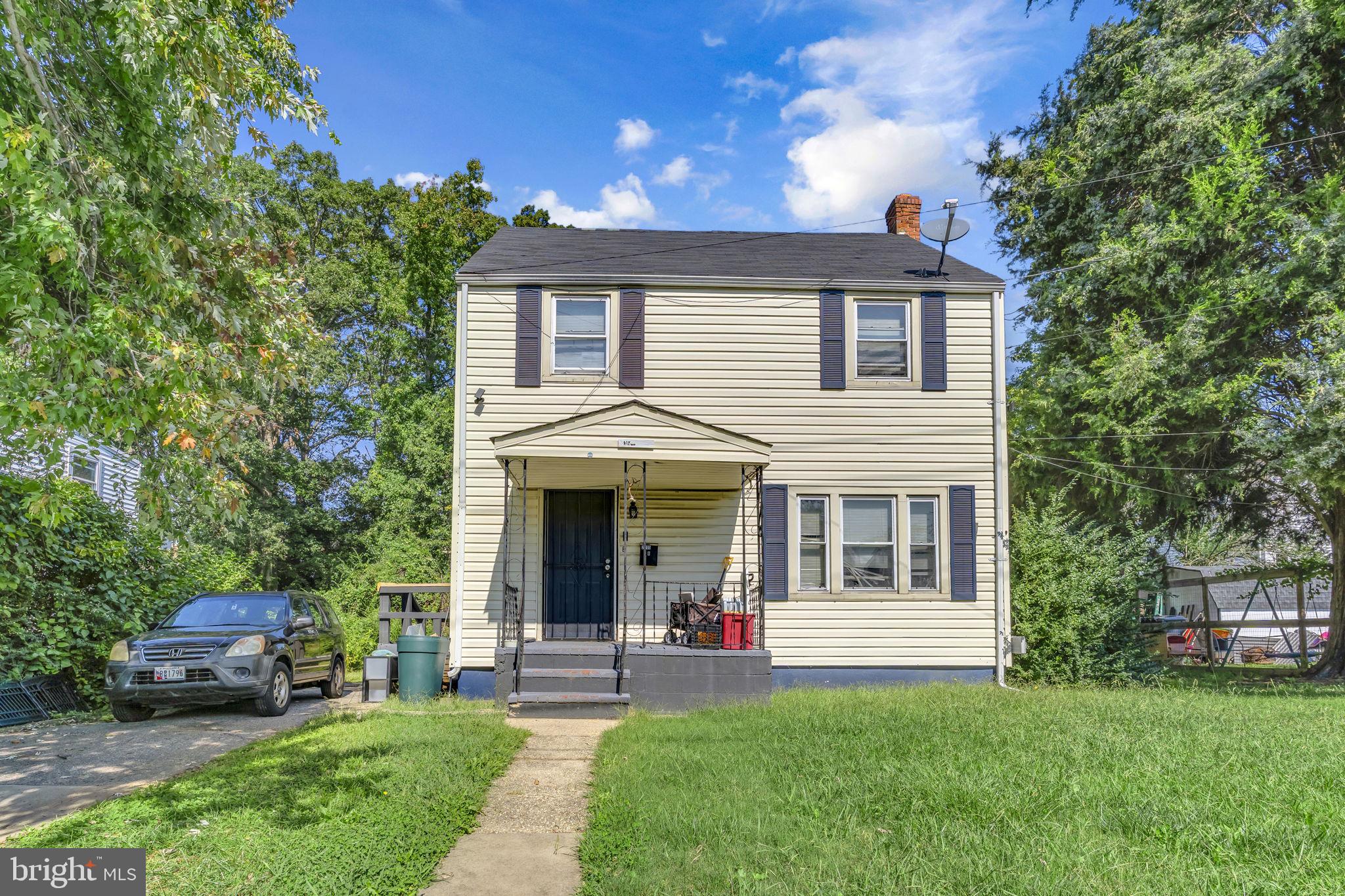 front view of a house with a yard