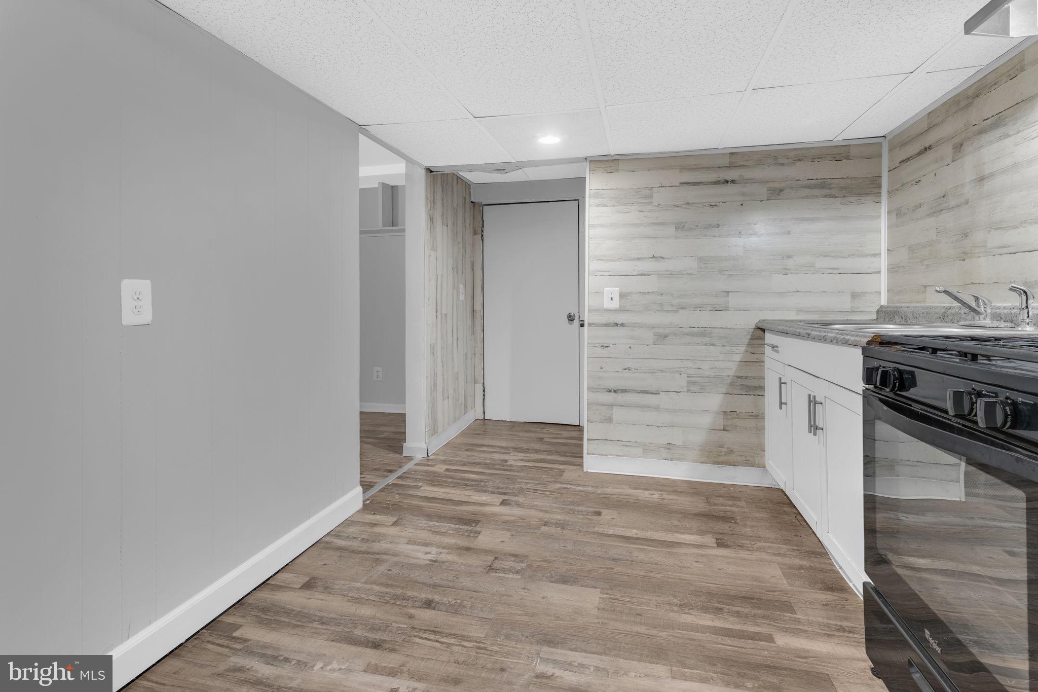 21705 Great Mills Lane, Unit C Lexington Park, MD 20653 - Photo 11 of 16 a view of a kitchen with a stove top oven