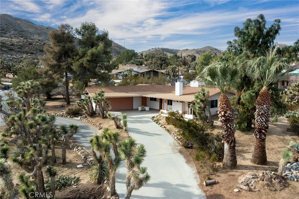 56808 Kismet Road Yucca Valley, CA 92284 - Photo 1 of 1 a view of a town with large trees