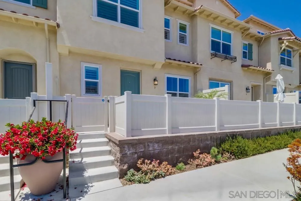 1257 Idanan Road, Unit 3 Chula Vista, CA 91913 - Photo 2 of 40 a front view of a house with a garden